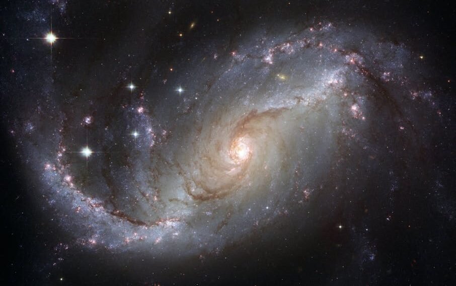 Capture of the NGC 1672 spiral galaxy showcasing its majestic spiral arms and bright core.